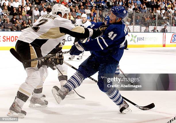 Nikolai Kulemin of the Toronto Maple Leafs is stood up by Nate Guenin of the Pittsburgh Penguins during a pre-season NHL game at the Air Canada...