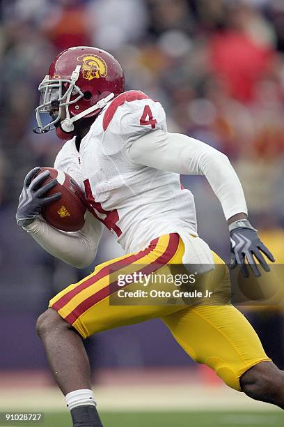 Joe McKnight of the USC Trojans carries the ball during the game against the Washington Huskies on September 19, 2009 at Husky Stadium in Seattle,...