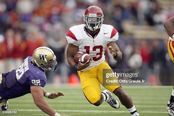 Stafon Johnson of the USC Trojans carries the ball during the game against the Washington Huskies on September 19, 2009 at Husky Stadium in Seattle,...