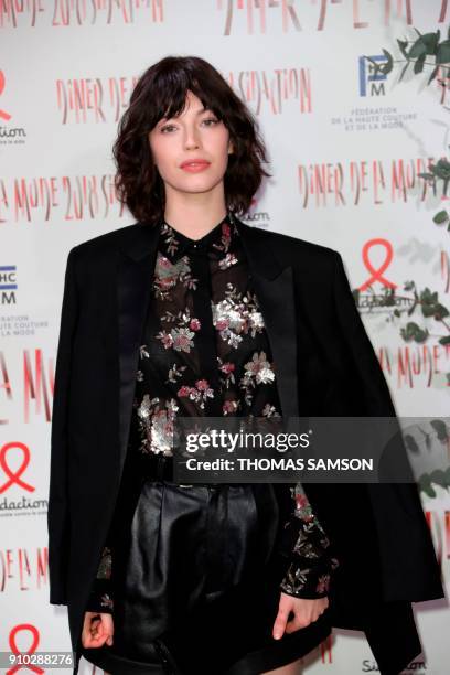 French actress Dorcas Coppin poses upon arriving to the Diner de la Mode fundraiser dinner, to benefit the French anti-AIDS association Sidaction, on...