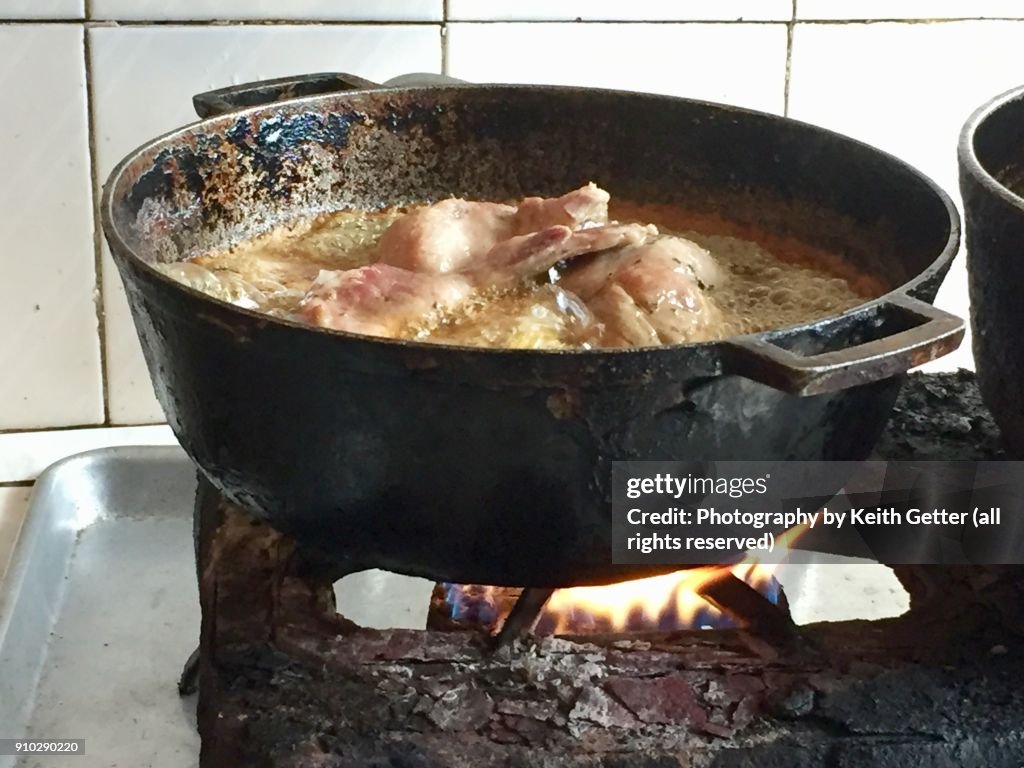 Cooking Chicken In Hot Oil on A Portable Natural Gas Stove