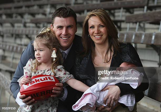 Matthew Lloyd of the Bombers poses with his wife Lisa, and duaghters, Jaeda and Kira after announcing his retirememnt from AFL football at Windy Hill...