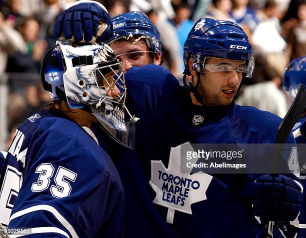 Vesa Toskala and Nazem Kadri of the Toronto Maple Leafs celebrate a win over the Pittsburgh Penguins in a pre-season NHL game at the Air Canada...