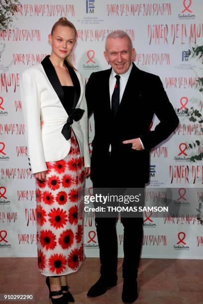 French fashion designer Jean-Paul Gaultier poses upon arriving to the Diner de la Mode fundraiser dinner, to benefit the French anti-AIDS association...