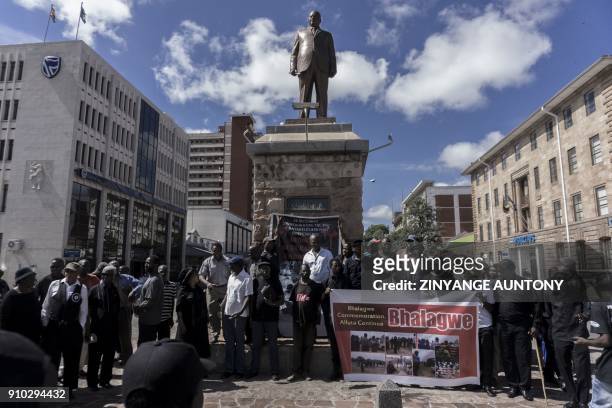 People gather at the Joshua Nkomo statue ahead of Unity Day commemorations on December 22, 2017 in Bulawayo, Zimbabwe to commemorate the killing that...
