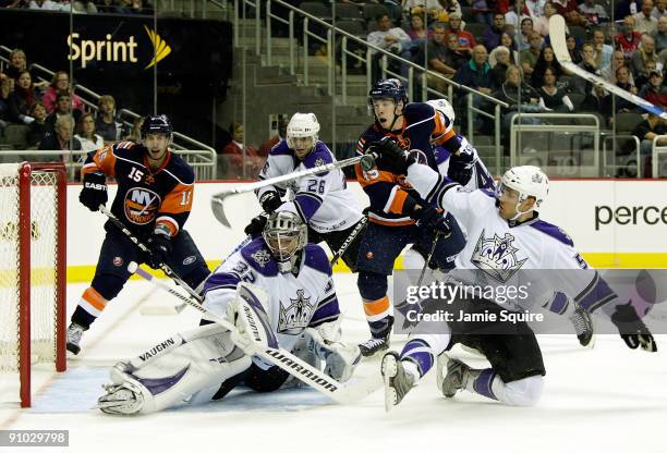 Alec Martinez of the Los Angeles Kings blocks a New York Islanders shot on goal with his stick during the preseason game against the New York...