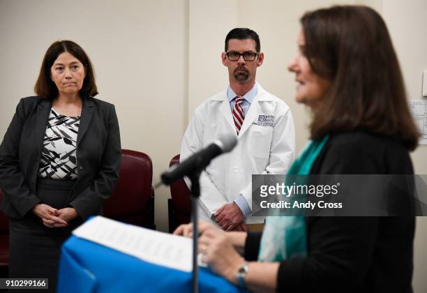 Denver Health CEO Robin Wittenstein, left, and Denver Health Community Health Pediatrician Steve Federico, center, listen to U.S. Rep. Diana DeGette...