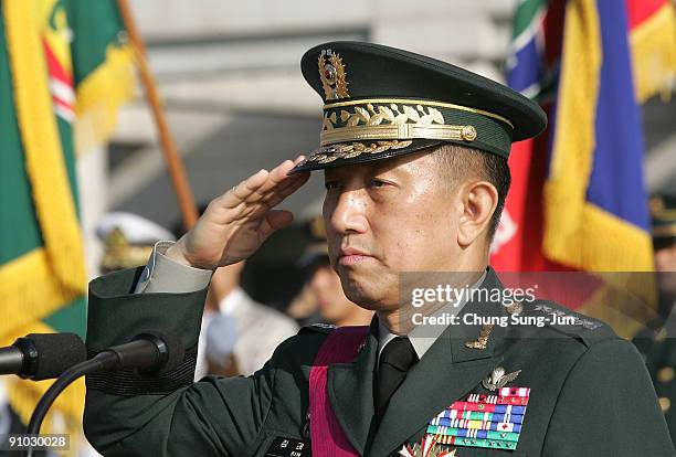 South Korea's new Defence Minister Kim Tae-Young salute during his farewell ceremony of the Joint Chiefs of Staff and before a inaugural ceremony for...