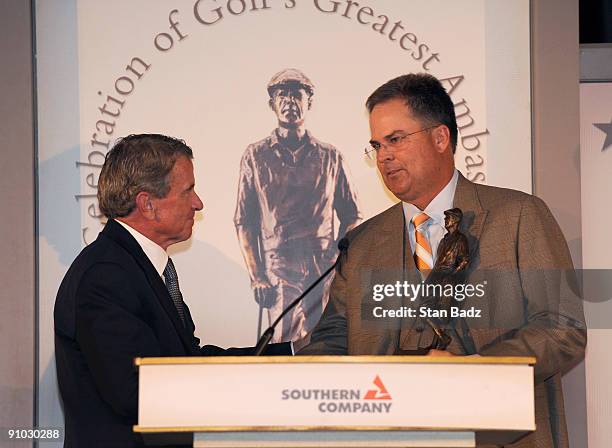 Commissioner Tim Finchem, left, presents 2009 recipient Kenny Perry, right, with the Payne Stewart Award who shared Payne Stewart's respect for the...