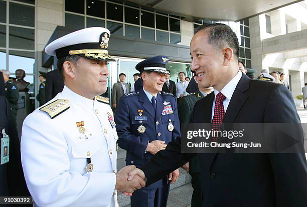 South Korea's new Defence Minister Kim Tae-Young shakes hands with general after his inaugural ceremony defence ministry on September 23, 2009 in...