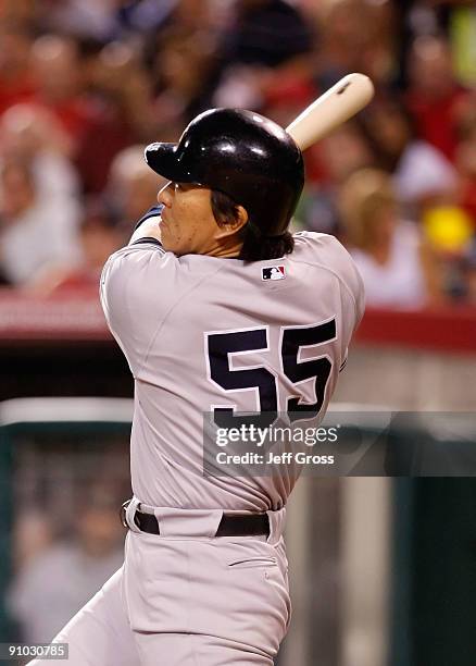 Hideki Matsui of the New York Yankees hits a solo home run in the fifth inning against the Los Angeles Angels of Anaheim at Angel Stadium on...