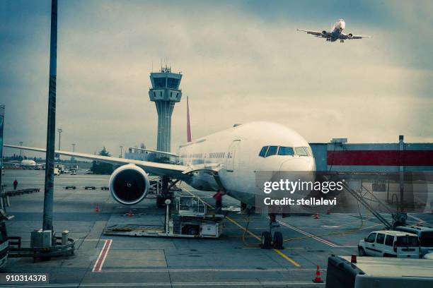 airplane parked at istanbul international airport. turkey - kingsford smith airport stock pictures, royalty-free photos & images