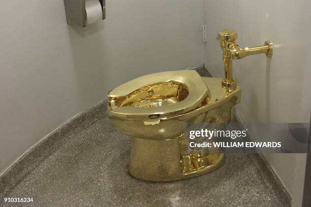 Fully functioning solid gold toilet, made by Italian artist Maurizio Cattelan, is going into public use at the Guggenheim Museum in New York on...