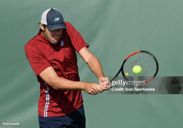 Reilly Opelka hits a backhand shot during a match against Dennis Novikov during the Oracle Challenger Series tournament played on January 25, 2018 at...