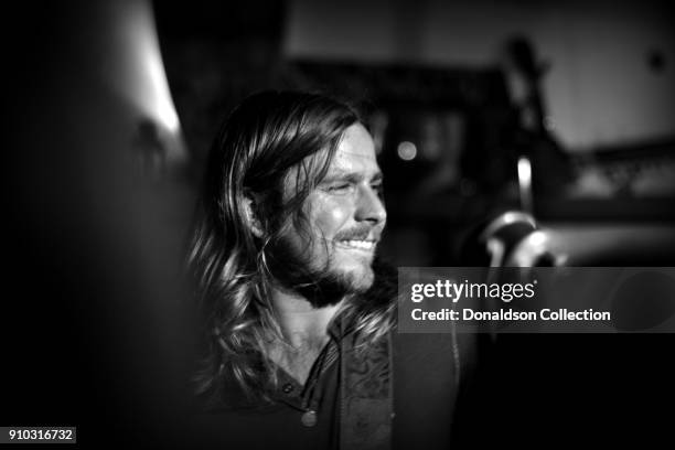 Lukas Nelson of the rock and roll band "Lukas Nelson and the Promise of the Real" performs onstage at a houseparty on November 29, 2013 in Topanga,...