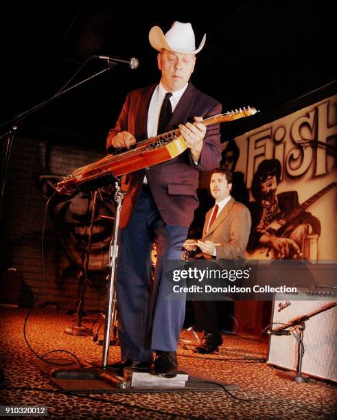 Musician Junior Brown performs onstage at Fishlips Bar and Grill on June 8, 2008 in Bakersfield, California .