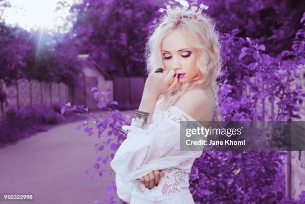 beautiful bride in violet garden - woman wearing purple dress stock pictures, royalty-free photos & images