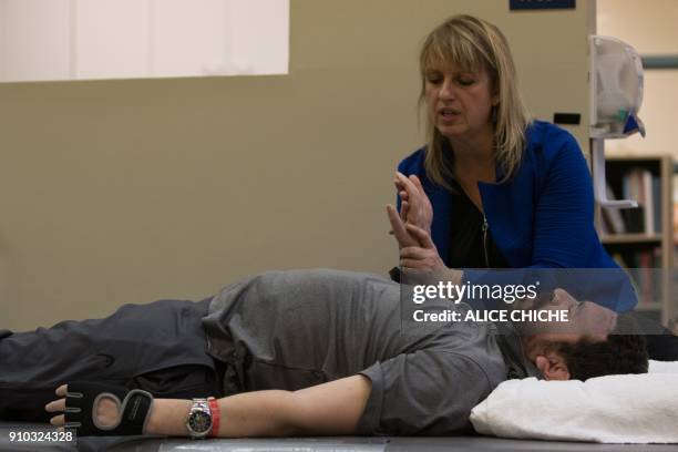 Aymen Derbali a victim of the Quebec City mosque attack, undergoes rehabilitation exercises on January 25, 2018 in Quebec City, Canada. Derbali has...