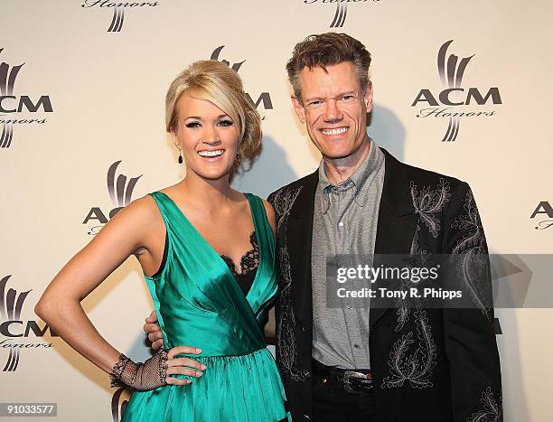 Carrie Underwood and Randy Travis arrive at the 2nd Annual ACM Honors at the Schermerhorn Symphony Center on September 22, 2009 in Nashville...