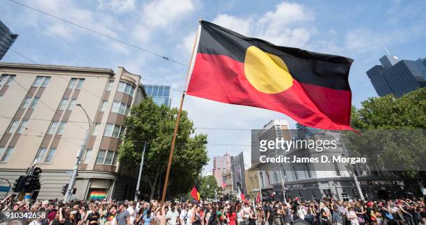 Protestors gather outside State Parliament with aboriginal flags on January 26, 2018 in Melbourne, Australia. Australia Day, formerly known as...