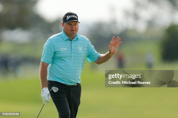 Ted Potter Jr. Waves to the crowd on the 17th green during the first round of the Farmers Insurance Open at Torrey Pines on January 25, 2018 in San...