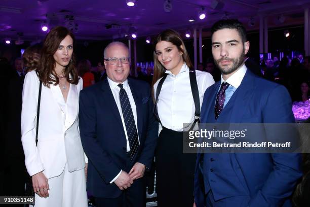 Aymeline Valade, a guest, Alice Pol and Tahar Rahim, all dressed in Ralph Lauren, attend the 16th Sidaction as part of Paris Fashion Week on January...