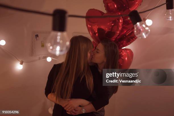 lesbian couple celebrating - photos of lesbians kissing stock pictures, royalty-free photos & images
