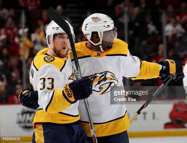 Viktor Arvidsson of the Nashville Predators celebrates his short handed goal with teammate P.K. Subban in the third period against the New Jersey...