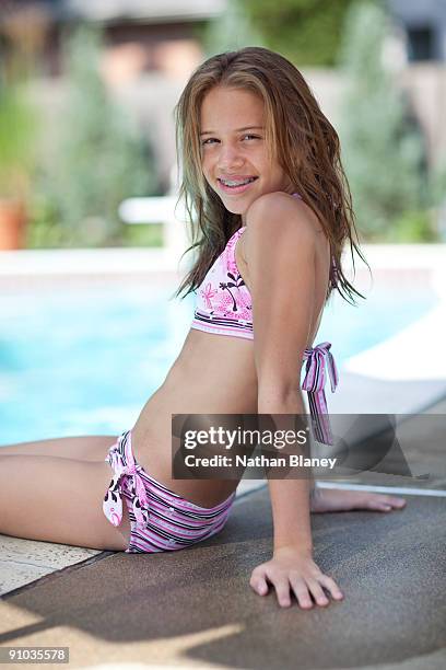 sitting by the pool - preteen swimwear bildbanksfoton och bilder