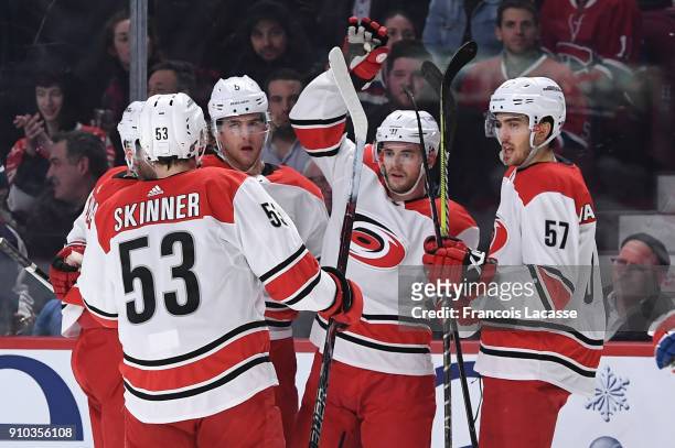 Derek Ryan of the Carolina Hurricanes celebrates with teammates after scoring a goal against the Montreal Canadiens in the NHL game at the Bell...