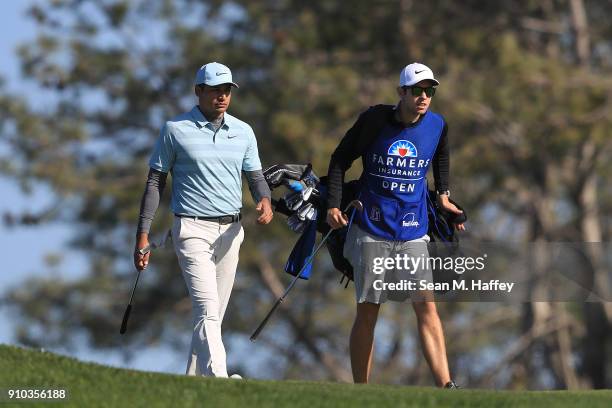 Julian Suri talks with his caddie on the second hole during the first round of the Farmers Insurance Open at Torrey Pines South on January 25, 2018...