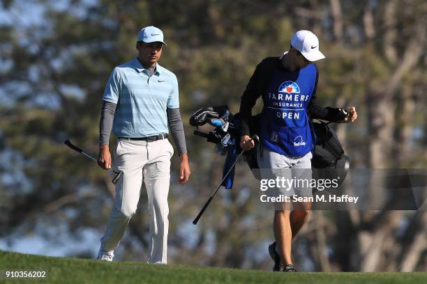 Julian Suri talks with his caddie on the second hole during the first round of the Farmers Insurance Open at Torrey Pines South on January 25, 2018...