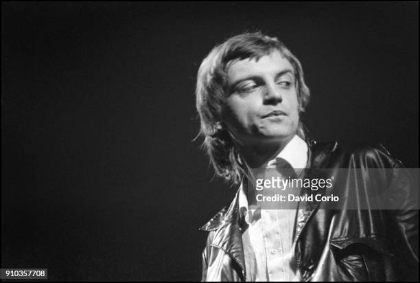 Mark E Smith of The Fall performing at The Lyceum Theatre, London, UK on 12 December 1982.
