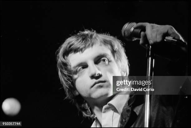 Mark E Smith of The Fall performing at The Lyceum Theatre, London, UK on 12 December 1982.