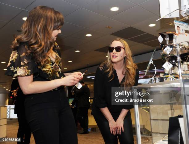 Kara Lindsay and Abby Mueller at Solstice sunglasses trying Polaroid polarized sunglasses during the GRAMMY Gift Lounge during the 60th Annual GRAMMY...