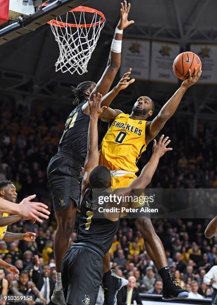 Rashard Kelly of the Wichita State Shockers drives to the basket against Chad Brown of the UCF Knights during the first half on January 25, 2018 at...