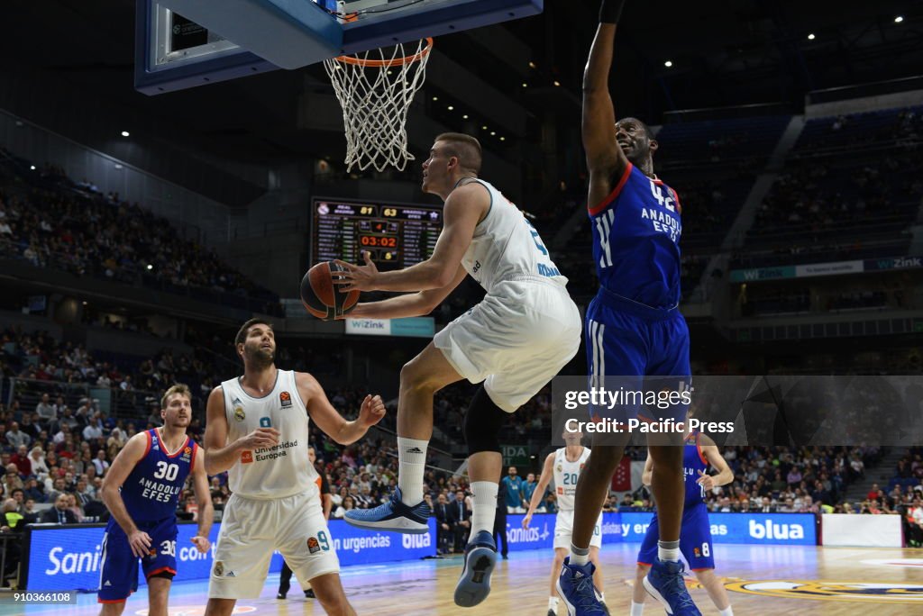 Dino Radoncic (center), #32 of Real Madrid in action during...