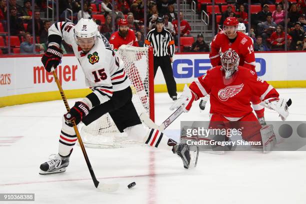 Artem Anisimov of the Chicago Blackhawks looks to shoot on Petr Mrazek of the Detroit Red Wings during the third period at Little Caesars Arena on...