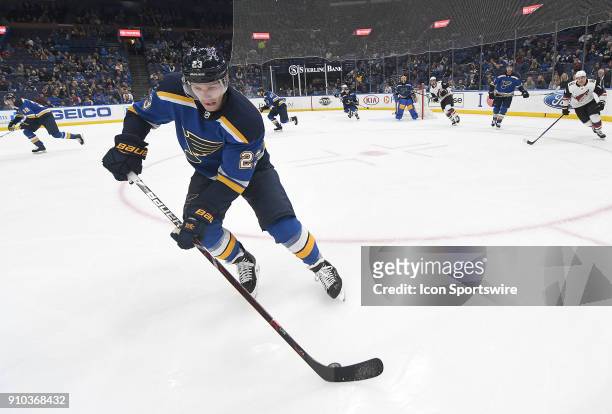 St. Louis Blues right wing Dmitrij Jaskin chases down a loose puck on the boards during a NHL game between the Arizona Coyotes and the St. Louis...