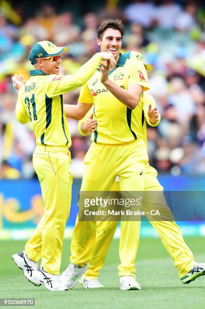 Pat Cummins of Australia celebrates after taking the wicket of Joe Root of Englandduring game four of the One Day International series between...