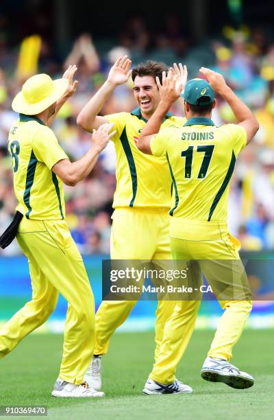 Pat Cummins of Australia celebrates after taking the wicket of Joe Root of Englandduring game four of the One Day International series between...