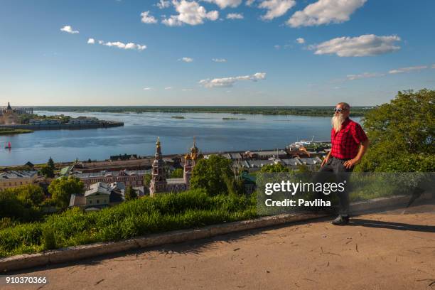 portrait of a senior man with white beard traveling on the volga river in russia - nizhny novgorod stock pictures, royalty-free photos & images