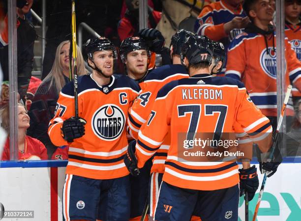 Connor McDavid, Leon Draisaitl, Zack Kassian and Oscar Klefbom of the Edmonton Oilers celebrate after a goal during the game against the Calgary...