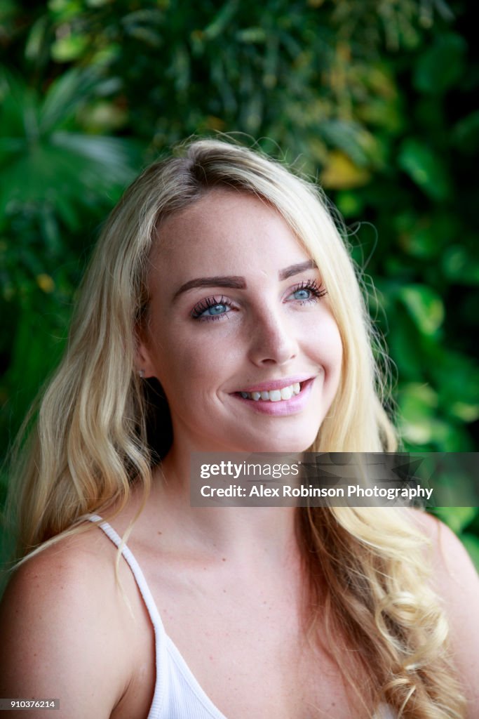 A young English woman with blonde hair and blue eyes