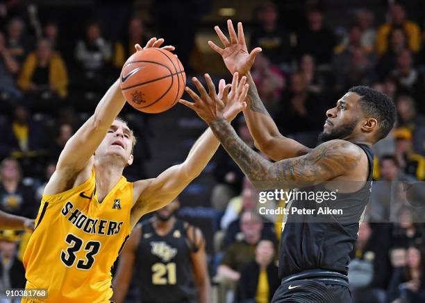 Conner Frankamp of the Wichita State Shockers reaches for a loose ball against Ceasar DeJesus of the UCF Knights during the second half on January...