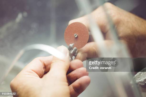 grinding dental implants - crown molding imagens e fotografias de stock