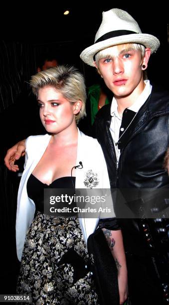 Television personality Kelly Osbourne and model Luke Worrall arrive at Whiskey Mist Nightclub for his DJ set on August 11, 2009 in London, England.