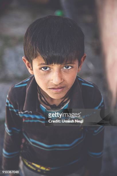 indian/asian kid looking at camera close-up - orphan boy stock pictures, royalty-free photos & images