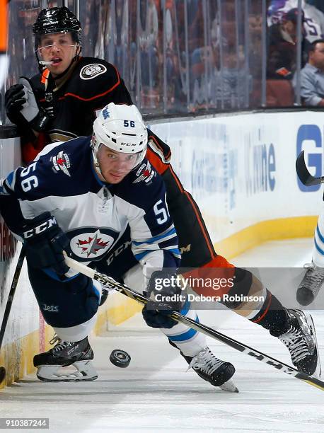 Marko Dano of the Winnipeg Jets battles for the puck against Rickard Rakell of the Anaheim Ducks during the game on January 25, 2018 at Honda Center...