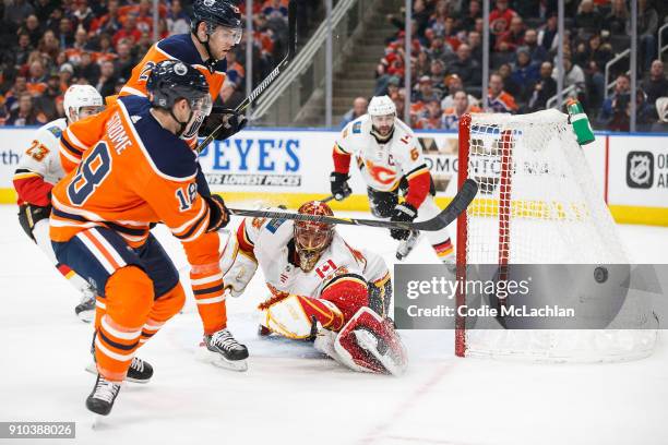 Ryan Strome of the Edmonton Oilers takes a shot on goaltender David Rittich of the Calgary Flames at Rogers Place on January 25, 2018 in Edmonton,...